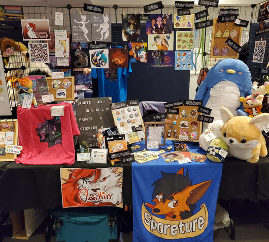 Sharing a table with Ozeikin at FurDU 2023